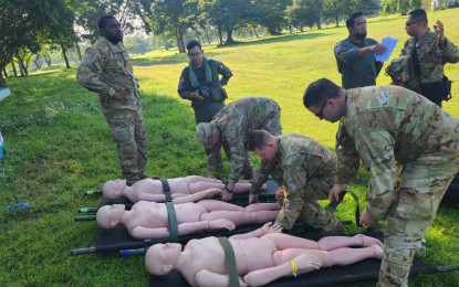 <p><strong>AUSTERE MEDICAL CARE.</strong> Participants prepare dummy patients for the mass casualty evacuation demonstration at Clark Air Base in Mabalacat, Pampanga in this undated photo, as part of the Pacific Airlift Rally 2023. The activity is aimed at ensuring that medical personnel of participating Air Force troops have the capability to operate in battlefield conditions.<em> (Photo courtesy of Philippine Air Force)</em></p>