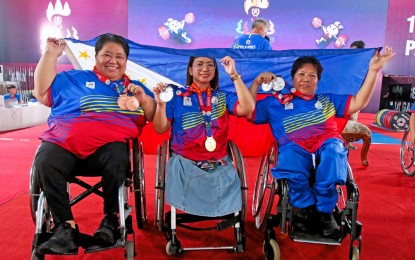 <p><strong>WOMEN POWER.</strong> Medalists Adeline Dumapong-Ancheta (+86kg), Marydol Pamati-an (41kg) and Achelle Guion (45kg) pose for a photo in the ASEAN Para Games in Phnom Penh, Cambodia on June 7, 2023. The three powerlifters will compete in the World Championships in Dubai, United Arab Emirates from Aug. 21 to 30.<em> (Photo courtesy of Philippine Sports Commission)</em></p>