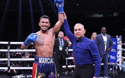 <p><strong>DETERMINED.</strong> Tokyo Olympics bronze medalist Eumir Felix Marcial (left) wins a pro fight via stoppage against Argentine Ricardo Ruben Villalba on Feb. 11, 2023. He will compete in the Hangzhou Asian Games next month, hoping to qualify for the 2024 Paris Olympics. <em>(Contributed photo)</em></p>