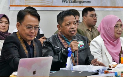 <p><strong>NEW MUNICIPALITIES.</strong> Bangsamoro Autonomous Region in Muslim Mindanao (BARMM) parliament member Kelly Antao (with mic) speaks during the deliberation of legislative bills creating eight new municipalities. Regional parliament members approved on the third and final reading the formation of the towns within BARMM’s Special Geographic Area in North Cotabato province on Thursday night (Aug. 17, 2023). <em>(Photo courtesy of BTA-BARMM)</em></p>