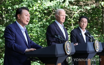 <p><strong>JOINT FORCES.</strong> South Korean President Yoon Suk Yeol, United States President Joe Biden and Japanese Prime Minister Fumio Kishida (from left) hold a joint press conference after their trilateral summit at the Camp David presidential retreat in Maryland, USA on Friday (Aug. 18, 2023). They agreed to elevate their trilateral security cooperation against what they described in a joint statement as "dangerous and aggressive actions" of the People's Republif of China. <em>(Yonhap)</em></p>