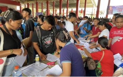 <p><strong>SCHOOL AID</strong>. Thousands of students line up to receive education assistance at the San Nicolas Mini Cultural Center in Laoag City on Aug. 17, 2023. Another education subsidy is available for tertiary students and the application is now ongoing. <em>(File photo by Leilanie G. Adriano)</em></p>