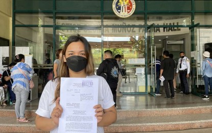 <p><strong>CRIMINAL COMPLAINT</strong>. Ma. Luisa Angel Peralta shows copy of the criminal complaint she filed against Gentle Hands Inc. (GHI) executive director Charity Heppner-Graff before the Quezon City Prosecutor’s Office on Wednesday (Aug. 23, 2023). The 28-year-old mother accused Heppner-Graff and several Jane and John Does of the GHI for allegedly conniving and conspiring in trying to get her consent to give up her 9-year-old daughter for adoption through "coercion, undue influence and fraud," <em>(Photo courtesy of Atty. Myreen Raginio)</em></p>