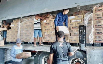 <p><strong>CONTINUOUS PROVISIONS.</strong> A total of 15,000 family food packs (FFPs) were unloaded at the Department of Social Welfare and Development-5 (Bicol) warehouse in Barangay Bogtong, Legazpi City on Wednesday (Aug. 23, 2023). The continued augmentation support for families affected by the ongoing Mayon Volcano unrest is part of DSWD Secretary Rex Gatchalian's commitment to Albay province.<em> (Photo courtesy of DSWD-5)</em></p>