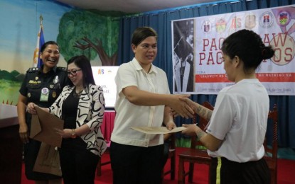 <p><strong>MOVING UP. </strong>Vice President and Department of Education Secretary Sara Duterte (3rd from left) graces the moving-up ceremony of the 220 persons deprived of liberty on Wednesday (Aug. 23, 2023). In her message, Duterte recognized the perseverance of the female inmates to pursue education amid incarceration. <em>(Photo courtesy of BJMP) </em></p>