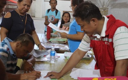 <p><strong>CASH PAYOUT</strong>. Ilocos Norte residents hit hard by Super Typhoon Egay receive cash payout on Aug. 3, 2023 at the Paoay Civic Center. The second batch composed of 4,376 beneficiaries will also get their cash payout courtesy of the Department of Social Welfare and Development emergency cash transfer starting Tuesday (Aug. 29, 2023) until Sept. 1. <em>(Contributed photo)</em></p>