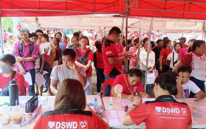 <p><strong>PAYOUT.</strong> Residents of Masbate whose livelihoods were affected by Typhoons Egay and Falcon in Masbate province received cash assistance under the DSWD's Assistance to Individuals in Crisis Situation program last week. DSWD-5 on Tuesday (Aug. 29, 2023) said each beneficiary received PHP4,000.<em> (Photo courtesy of DSWD-Bicol)</em></p>