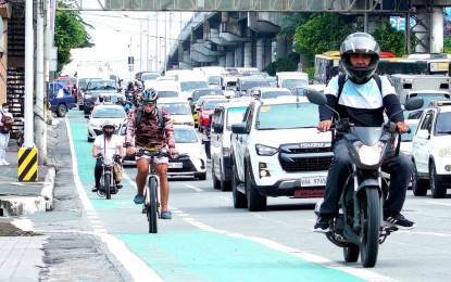 <p><strong>EDSA BIKE LANE.</strong> A man pedals along the EDSA bike lane near Main Avenue Street, Cubao, Quezon City on Aug. 29, 2023. The Department of Transportation on Friday (April 26, 2024) said pedestrians and cyclists are the highest priority among road users, with active transport infrastructure projects remaining a major part of the Marcos administration's Build, Better, More program. <em>(PNA photo by Ben Briones)</em></p>