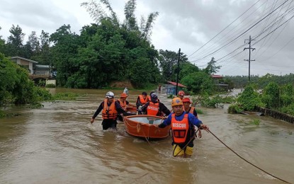 <p><strong>GORING'S FURY.</strong> A rescue team of the City Disaster Risk Reduction and Management Council in Batac City, Ilocos Norte helps evacuate flooded residents in Barangay Quiling Norte on Wednesday (Aug. 30, 2023). Ilocos Norte Governor Matthew Joseph Manotoc earlier declared suspension of work and classes due to bad weather. <em>(Photo courtesy of the City Government of Batac)</em></p>