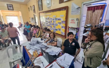 <p><strong>ASPIRANTS.</strong> Antique Provincial Election Supervisor Salud Milagros Villanueva (right) oversees the filing of Certificates of Candidacy (COCs) for the Barangay and Sangguniang Kabataan (SK) elections  in Tobias Fornier, Antique on Tuesday . Villanueva said Wednesday (Aug. 30, 2023)  3,665 aspirants have filed their COC as of Aug. 29. (<em>PNA photo courtesy of Comelec Antique</em>)</p>