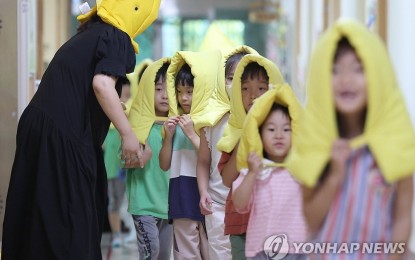 <p><strong>LOW BIRTHS</strong>. Kindergartners participate in a drill at a kindergarten in Daegu, 237 kilometers southeast of Seoul, on Aug. 23, 2023. South Korea total births and fertility rate fell to record lows in 2022. <em>(Yonhap)</em></p>