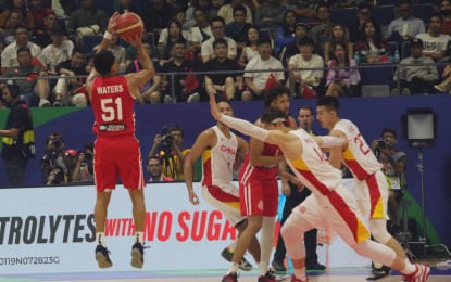 <p><strong>TOP 16.</strong> Puerto Rico's Tremont Waters shoots the ball from mid-range during the match against China on Wednesday (Aug. 30, 2023) at the Smart Araneta Coliseum in Quezon City. Puerto Rico won, 107-89, completing the cast for Group I in the second round along with Serbia, Dominican Republic and Italy. <em>(PNA photo by Avito C. Dalan)</em></p>