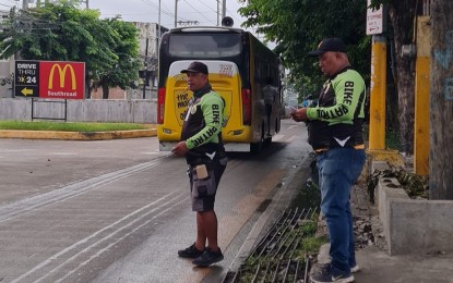<p><strong>BIKE LANE ENFORCERS</strong>. Cebu City bike lane enforcers watch for violators as vehicles pass by the Natalio Bacalso Ave. in Cebu City, in this undated photo. Bike lane executive director Bernard Maraasin on Thursday (Aug. 31, 2023) said bike owners will soon be required to register their bicycles beginning November. <em>(Photo courtesy of Sugbo Bike Lanes Board)</em></p>