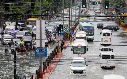 <p><strong>GUTTER-DEEP.</strong> Motorists pass through gutter-deep floodwater along España Boulevard near Maceda Street in Manila after a downpour on Thursday (Aug. 31, 2023). Several areas in Metro Manila were reported to be flooded as the enhanced southwest monsoon or “<em>habagat</em>” dumped rains over a large part of the country. <em>(PNA photo by Yancy Lim) </em></p>