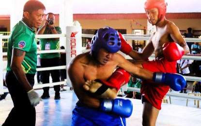 <p><strong>QUICK WIN.</strong> Mark Christian Ursabia of University of Mindanao-Davao (red) delivers a kick against Renz Pejana of Zamboanga del Sur Provincial College during the men's 60kgs low kick final in the kickboxing competition of the 1st Philippine Reserve Officers' Training Corps Games Mindanao leg at the Western Mindanao State University covered court on August 31, 2023. Ursabia needed less than three minutes in the first round to win the match. <em>(Photo courtesy of the Philippine Sports Commission)</em></p>