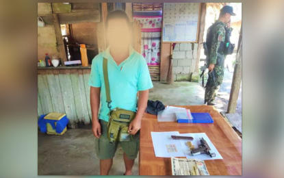 <p><strong>GUN BAN VIOLATOR.</strong> Military personnel arrested a man for an unlicensed gun and violation of the election gun ban in Cotabato City on Wednesday (Aug. 31, 2023). The suspect did not resist arrest when accosted at a Marine checkpoint in Barangay Kalanganan, Cotabato City.<em> (Photo courtesy of IATF Kutawato)</em></p>