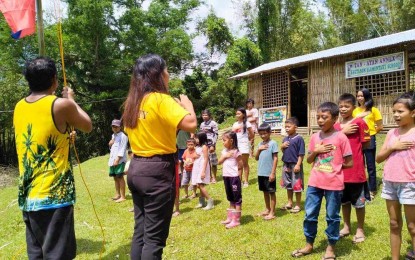 <p><strong>MAKESHIFT CLASSROOM</strong>. Learners at the newly established Tan-ayan Annex hold their first flag-raising ceremony during their first day in school in Sitio Tan-ayan in Barangay Bagtason, Bugasong, on Thursday (Aug. 31, 2023). OIC District Supervisor Daryl Aguelles and the principal of the Bagtason Elementary School said Friday the school caters to 24 learners, including the five who availed of the Alternative Learning System. (<em>PNA photo courtesy of Dr. Daryl Arguelles</em>)</p>