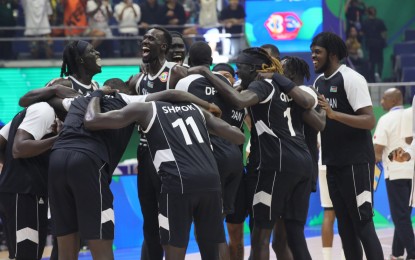 <p><strong>PARIS, WE'RE COMING. </strong>Sudan celebrates on center court after beating Angola, 101-78, in the FIBA Basketball World Cup Classification 17-32 Round at Smart Araneta Coliseum in Quezon City on Saturday (Sept. 2, 2023). Coupled with New Zealand nipping Egypt, 88-86, at Mall of Asia Arena in Pasay City, Sudan ended up the top-ranked African team and grabbed one of eight automatic Olympics seats.<em> (PNA photo by Avito C. Dalan)</em></p>