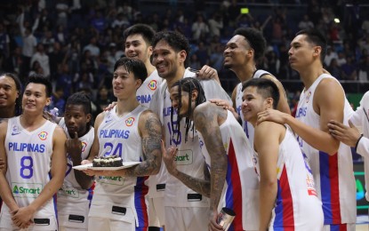 <p><strong>PRE-GAME CELEBRATION.</strong> Dwight Ramos turns 25 and gets a birthday cake prior to the Philippines-China match at the FIBA Basketball World Cup Classification 17-32 Round at Smart Araneta Coliseum in Quezon City on Saturday (Sept. 2, 2023). The Philippines ended its campaign with a first win in five games, 96-75.<em> (PNA photo by Avito C. Dalan)</em></p>
