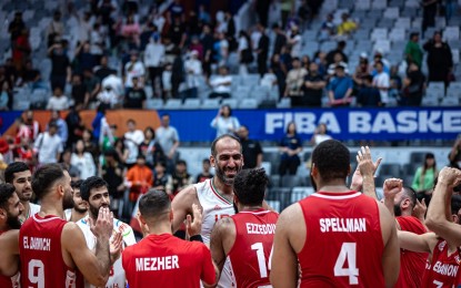 <p><strong>END OF AN ERA.</strong> Iran's Hamed Haddadi (center) is feted by their Lebanese opponents after playing his last national team game at the FIBA Basketball World Cup in Jakarta, Indonesia on Saturday (Sept. 2, 2023). Lebanon won, 81-73, but the night will be best remembered as the farewall match of the 38-year-old, regarded as Iran's greatest cager of all time. <em>(FIBA)</em></p>