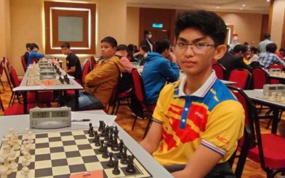 <p><strong>MOTIVATED.</strong> FIDE Master Christian Gian Karlo Arca at the 18th IGB Dato' Arthur Tan Malaysian Open Chess Championship in Kuala Lumpur, Malaysia. Arca finished the nine-round tournament with 6.0 points to earn one of the three required norms to become an International Master. <em>(Photo courtesy of Arman Arca)</em></p>