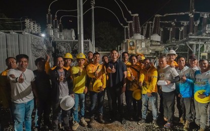 <p><strong>POWER IS BACK.</strong> Victorias City Mayor Javier Miguel Benitez (center) with personnel of Northern Negros Electric Cooperative after the 15 MVA power transformer loaned by the Central Negros Electric Cooperative was energized Sunday night (Sept. 3, 2023). By then power supply had been restored in Victorias and the towns of E.B. Magalona and Manapla after a six-day blackout caused by the breakdown of the original substation on the night of Aug. 28. (<em>Photo courtesy of Javi Benitez Facebook page)</em></p>