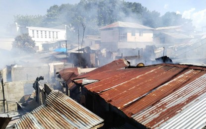 <p><strong>RAZED.</strong> At least 30 homes made of semi-concrete and light materials were razed to the ground in a fire that started at about 1 p.m. Tuesday (Sept. 4, 2023) in the residential area of Barangay Rosary Heights 7, Cotabato City. A male resident was slightly hurt while saving his valuables. <em>(Photo courtesy of Mark Tayco/Radio DXMS)</em></p>