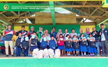 <p><strong>READY FOR SCHOOL.</strong> Young learners receive education aid and school supplies from the Bangsamoro Ministry of Basic, Higher, and Technical Education (MBHTE) as the school year begins. The MBHTE-BARMM on Tuesday (Sept. 5, 2023) listed 1.2 million students enrolled in the current school year. <em>(Photo courtesy of MBHTE BARMM)</em></p>