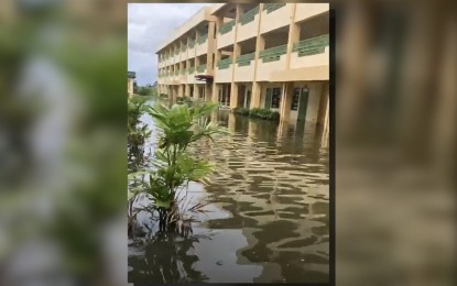 <p><strong>FLOODED CAMPUS</strong>. A public high school in Macabebe, Pampanga is still submerged in floodwater as of Tuesday (Sept. 5, 2023) due to occasional moderate to heavy rains caused by the enhanced southwest monsoon. Some local government units in Pampanga declared the cancellation of classes due to flooded school grounds. <em>(Photo courtesy of Macabebe LGU)</em></p>