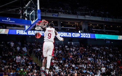 <p><strong>EASY SHOT.</strong> Canada's RJ Barrett dunks the ball in a fast break during their quarterfinal match against Slovenia at the Mall of Asia Arena in Pasay City on Wednesday (Sept. 6, 2023). Canada will now face Serbia in the semifinals, their first-ever in World Cup history. <em>(Photo from FIBA)</em></p>
