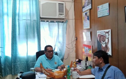 <p><strong>RABIES-FREE CITY.</strong> Dr. Emmanuel Estipona (left), chief of the City Veterinary Office in Legazpi, answers queries on their program to sustain the city's long-standing record as a “zero-rabies” locality from 2019 to the present, on Thursday (Sept. 7, 2023). A total of 15,278 dogs in the city were vaccinated against rabies from January to August. <em>(Photo by CVO staff)</em></p>