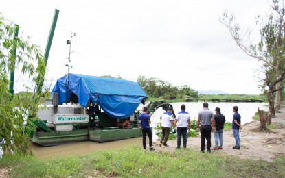 <p><strong>DREDGING OPS</strong>. Officials of the Department of Public Works and Highways inspect the ongoing dredging operations in the towns of San Simon and Sto. Tomas in Pampanga in this undated photo. The dredging activities are being undertaken as an immediate measure to mitigate flooding in the province. <em>(Photo courtesy of DPWH Region 3)</em></p>