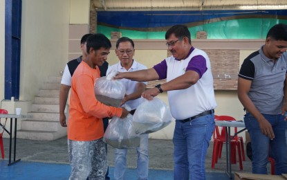 <p><strong>FRY DISTRIBUTION.</strong> Bureau of Fisheries and Aquatic Resources-Central Luzon Regional Director Wilfredo Cruz leads the distribution of milkfish fry to fish farmers in Paombong, Bulacan on Thursday (Sept. 7, 2023). A total of 900,000 milkfish fry was allotted for distribution to the fishers to help them recover from losses brought by recent weather disturbances and at the same time boost milkfish production in the town. <em>(Photo courtesy of BFAR Central Luzon)</em></p>