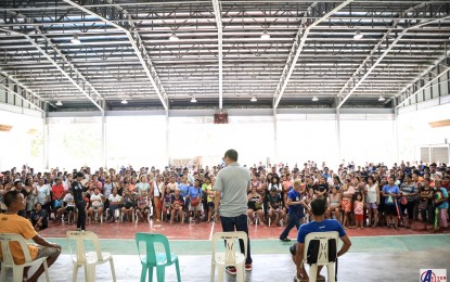 <p><strong>DECAMPMENT</strong>. Mayor Joseling Aguas (center) of Sto. Domingo, Albay on Friday (Sept. 8, 2023) speaks to people being sheltered in an evacuation center in the town due to the restiveness of Mayon Volcano. He told the families in the various evacuation centers across the town to return home as the volcano has been showing decreasing signs of restlessness. <em>(Photo courtesy of Sto. Domingo LGU)</em></p>