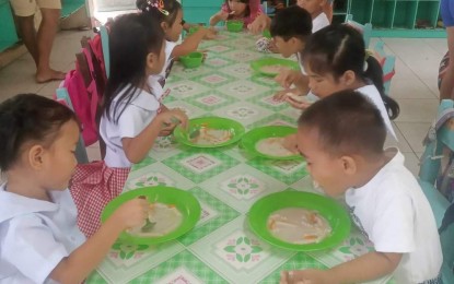 <p><strong>FEEDING</strong>. Children enrolled in a Child Development Center in Antique enjoy the Supplementary Feeding Program in this undated photo. The Department of Social Welfare and Development on Thursday (Jan. 4, 2024) said over 1.9 million children have benefitted from the DSWD’s feeding programs in 2023. <em>(PNA photo courtesy of Antique PSWDO)</em></p>