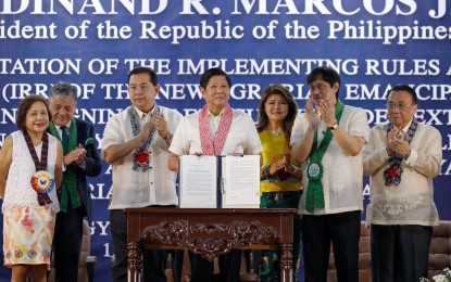 <p><strong>FOR THE FARMERS.</strong> President Ferdinand R. Marcos Jr. on Tuesday (Sept. 12, 2023) attends the ceremony for the presentation of the implementing rules and regulations of RA 11953 and for the signing of an executive order extending the moratorium on payments of amortizations on agrarian debt at the Department of Agrarian Reform office in Quezon City. Marcos emphasized the importance of helping some 610,054 agrarian reform beneficiaries to help the government attain its bid for food security. <em>(PNA photo by Rey Baniquet)</em></p>