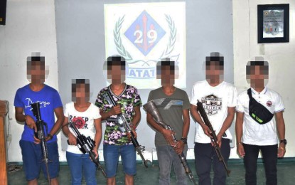 <p><strong>SURRENDER.</strong> Six New People’s Army rebels yield to state forces in Cabadbaran City, Agusan del Norte on Monday (Sept. 11, 2023), handing over five high-powered firearms. A separate clash resulted in the killing of a communist rebel in Tandag City, Surigao del Sur. <em>(Photo courtesy of 4ID)</em></p>