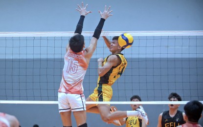 <p><strong>POWERFUL ATTACK.</strong> Martin Bugaon of Far Eastern University (No. 14) unleashes a powerful attack against Kenneth Batiancila of Emilio Aguinaldo College (No. 15) during the 2023 V-League Men's Collegiate Challenge at the Paco Arena in Manila on Sept. 13, 2023. The Tamaraws won, 25-21, 25-18, 25-21, to boost their semi final bid. <em>(Photo courtesy of V-League)</em></p>