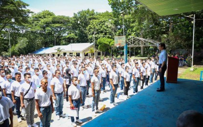 <p><strong>ASPIRING COPS.</strong> DILG Secretary Benjamin Abalos Jr. (right) on Wednesday (Sept. 13, 2023) speaks to police applicants who are former combatants of the Moro Islamic Liberation front (MILF) and Moro National Liberation Front (MNLF) during the start of the screening process at Camp Pendatun, Maguindanao del Norte. The entry of former MILF and MNLF members in the PNP is covered by Republic Act 11054 or the Organic Law for BARMM, which was enacted after the signing of a peace agreement between the government and the MILF. <em>(Photo courtesy of DILG)</em></p>