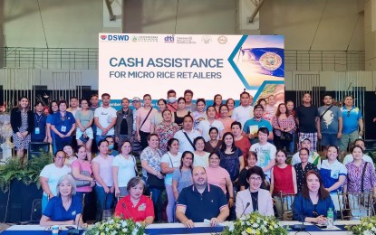 <p><strong>RICE AID BENEFICIARIES.</strong> The 63 micro rice retailers in Negros Oriental who each received PHP15,000 in emergency relief subsidy from the Department of Social Welfare and Development 7 (Central Visayas) during a ceremony at the convention center in Dumaguete City on Thursday afternoon (Sept. 14, 2023). The aid is to alleviate their losses while adjusting their selling prices for regular milled and well-milled rice in compliance with Executive Order 39. <em>(PNA photo by Judy Flores Partlow)</em></p>