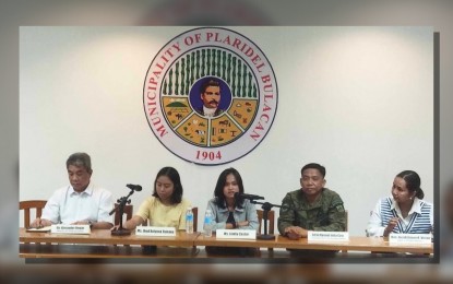 <p><strong>SUDDEN CHANGE OF HEART.</strong> Jhed Tamano (second from left) and Jonila Castro (center) answer questions from journalists during a press conference held at the Municipal Building of Plaridel, Bulacan on Tuesday morning (Sept. 19, 2023). The National Task Force to End Local Communist Armed Conflict slammed the two environmentalists' sudden claim that they were abducted and threatened by soldiers, contrary to reports that they have voluntarily surrendered. <em>(PNA photo by Manny Balbin)</em></p>