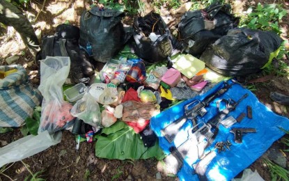 <p><strong>ENCOUNTER</strong>. Government troops recover firearms and ammunition after they encountered a group of NPA rebels at Sitio Agdalusan, Barangay Jayubo, in Lambunao town, Iloilo, Tuesday (Sept. 19, 2023). A rebel and a soldier died in the encounter.<em> (PNA photo courtesy of 3rd DPAO)</em></p>