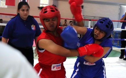 <p><strong>FINALIST.</strong> Maria Reina Bantaya of Cavite State University (right) beats Queen Dhylan Ortega of the University of Batangas-Lipa during their quarterfinal bout in the 52kg class of the Philippine Army division in the Reserve Officers' Training Corps (ROTC) Games Luzon leg kickboxing competition at the Tagaytay Combat Sports Center on Sept. 19, 2023. Bantaya defeated Maria Gwynneth Puno of Tarlac State University (TKO R-2 1:04s) in the semifinal on Wednesday. <em>(Photo courtesy of Philippine Sports Commission)</em></p>
