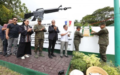<p><strong>SYMBOL OF PEACE.</strong> AFP chief Gen. Romeo Brawner Jr. (2nd from right) joins Office of the Presidential Adviser on Peace, Reconciliation and Unity (OPAPRU) Secretary Carlito Galvez Jr. (center) and other guests during the unveiling of the "Symbol of Peace" monument on Thursday (Sept. 21, 2023) at the headquarters of 6th Infantry Division in Maguindanao del Norte. The AFP attributed the successful peace and development efforts in the Bangsamoro to the whole-of-nation approach and the support of the communities. <em>(Photo courtesy of the AFP)</em></p>