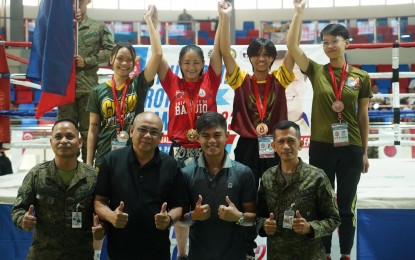 <p><strong>CHAMPION.</strong> University of Baguio's Bety Mae Churping (back row, 2nd from left) captures the women's 52kg gold medal in the Reserve Officers' Training Corps (ROTC) Games Luzon leg kickboxing competition at the Tagaytay Combat Sports Center on Thursday (Sept. 21, 2023). With her on the podium are (L-R) silver medalist Maria Reina Bantaya of Cavite State University and bronze medalists Maria Gwynneth Puno of Tarlac State University and Jheykye Aguinoas of Don Mariano Marcos State University South La Union campus. <em>(Contributed photo)</em></p>