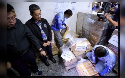 <p><strong>BSKE PRINTED BALLOTS</strong>. Commission on Elections (Comelec) Chairperson George Erwin Garcia (2nd from left) and other officials inspect the printed ballots and forms needed for the Barangay and Sangguniang Kabataan Elections (BSKE), during the culmination ceremony for the printing, at the National Printing Office in Diliman, Quezon City on Thursday (Sept. 21, 2023). The Comelec reported that about 92 million official manual ballots have been printed. <em>(PNA photo by Joseph Razon)</em></p>
