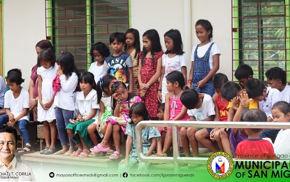 <p><strong>NEW SCHOOL BUILDING.</strong> School children in the tribal village of Barangay Bolhoon, San Miguel, Surigao del Sur, witness the turnover of a new school facility on Sept. 20, 2023. Six school buildings were funded under the Barangay Development Program of the National Task Force to End Local Communist Armed Conflict.<em> (Photo courtesy of LGU San Miguel)</em></p>