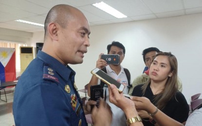 <p><strong>POLITICALLY NEUTRAL.</strong> Police Regional Office-7 Spokesperson, Lt. Col. Gerard Ace Pelare, answers queries from the media at the sideline of a forum on the state of news reporting at the Marcelo Fernan Press Center in Cebu City on Thursday (Sept. 21, 2023). Pelare said nearly 450 members of PRO-7 whose relatives are running for BSKE have been reassigned to different units. <em>(PNA photo by John Rey Saavedra)</em></p>