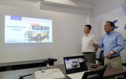 <p><strong>E-JEEPNEYS IN BACOLOD</strong>. Officials of e-Future Motors Philippines Inc., chief executive officer BK Shin (left), and chief operating officer Robert Cerrada present updates on the e-jeepneys that would soon arrive in the country at a press briefing at their office in Bacolod City on Friday (Sept. 22, 2023). Tapping local transport operators under the Public Utility Vehicle Modernization Program, the Chinese-Korean e-vehicle maker is arranging the arrival of 36 units from China to Bacolod by the end of November. <em>(PNA photo by Nanette L. Guadalquiver)</em></p>