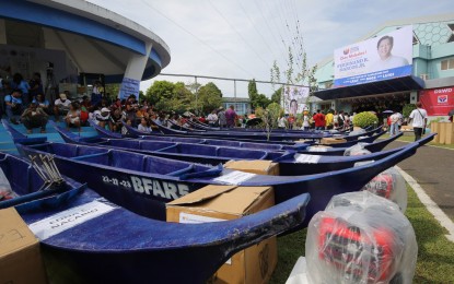 <p><strong>LIVELIHOOD AID.</strong> Motorized fishing boats are given away during the Bagong Pilipinas Serbisyo Fair at the Camarines Sur Polytechnic Colleges in Nabua town, Camarines Sur on Saturday (Sept. 23, 2023). President Ferdinand R. Marcos Jr. led the national launch of the fair that consolidates various programs and services from different national government agencies in one venue, including the delivery of assistance programs.<em> (PNA photo by Joan Bondoc)</em></p>